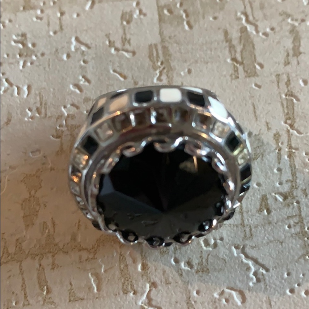 Large black and checkered ring